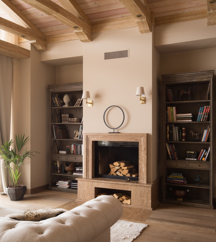 Ejemplo de dormitorio principal clásico renovado con paredes beige, suelo de madera en tonos medios y suelo marrón