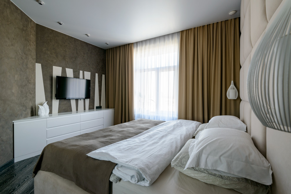 Photo of a large contemporary master bedroom in Novosibirsk with brown walls, dark hardwood flooring and black floors.