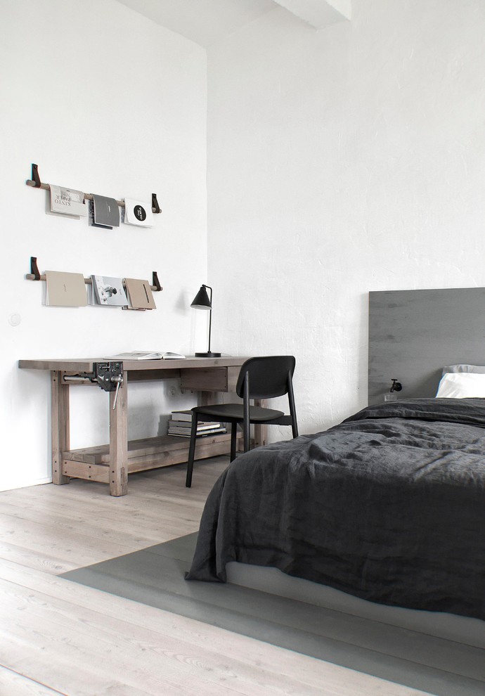 Inspiration for a small industrial master beige floor and light wood floor bedroom remodel in Saint Petersburg with white walls