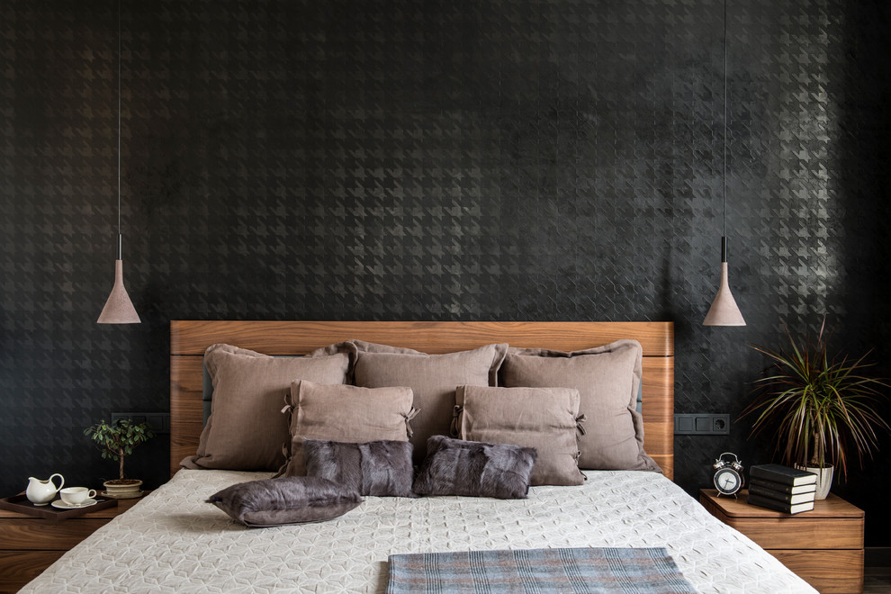Example of a trendy master bedroom design in Moscow with black walls and no fireplace