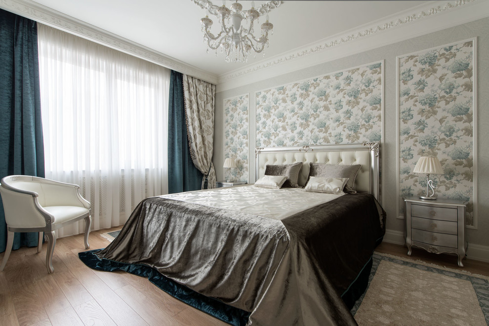 Classic grey and brown bedroom in Moscow with grey walls, medium hardwood flooring, brown floors and feature lighting.