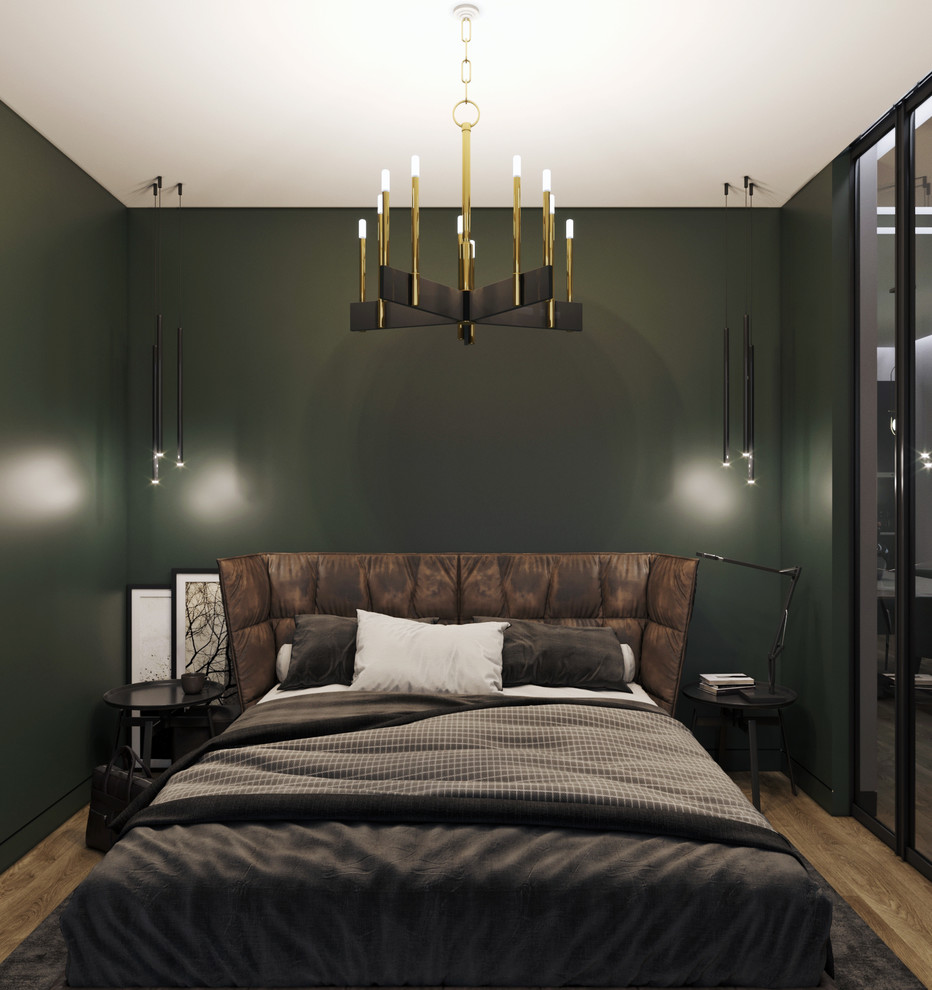 Example of a small trendy master laminate floor and beige floor bedroom design in Moscow with green walls and no fireplace
