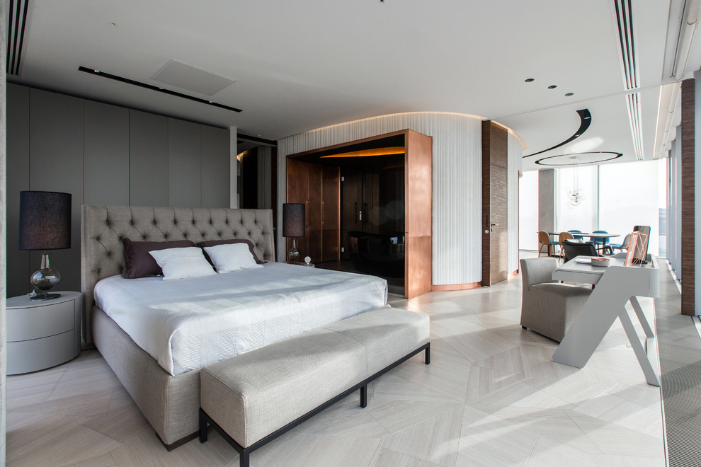 This is an example of a contemporary master bedroom in Moscow with porcelain flooring.