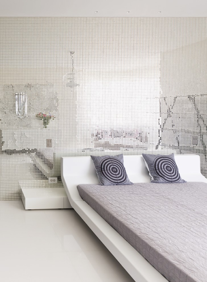 Large contemporary master bedroom in Moscow with white walls and no fireplace.