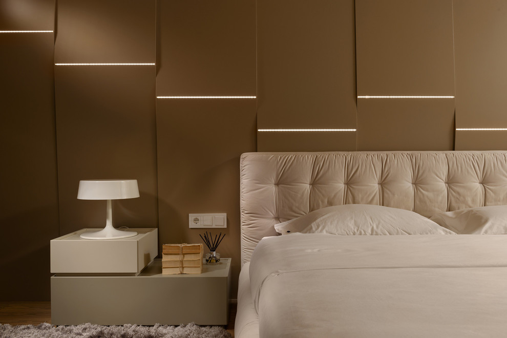 Inspiration for a contemporary bedroom in Moscow with feature lighting.
