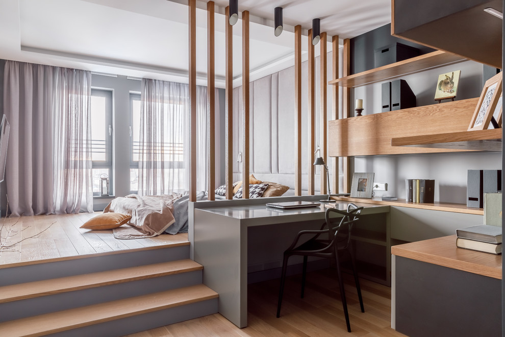 Bedroom - contemporary master medium tone wood floor and brown floor bedroom idea in Other