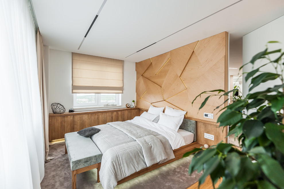 Foto di una camera da letto minimal con pareti bianche, moquette e pavimento grigio