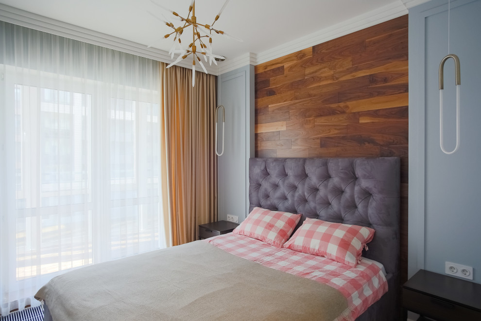 Foto di una camera da letto contemporanea con pareti in legno