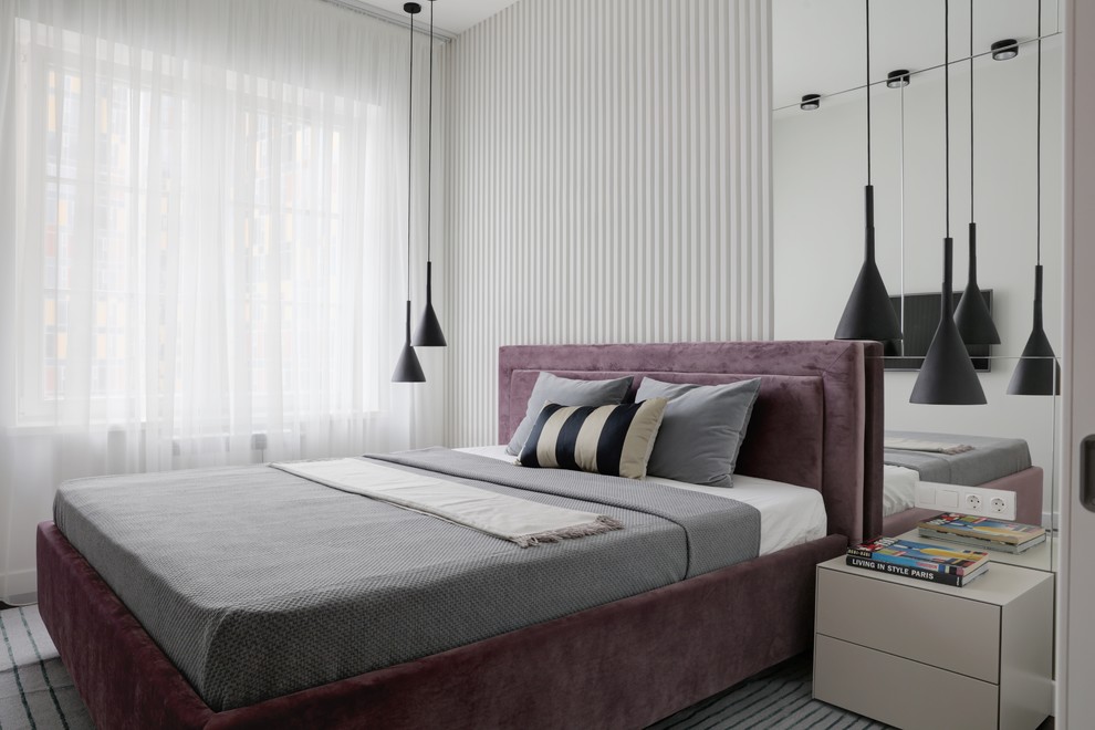 Design ideas for a contemporary master bedroom in Moscow with white walls.
