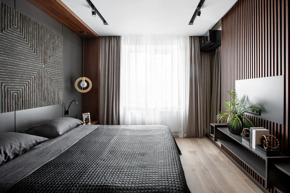 Photo of a medium sized contemporary master bedroom in Yekaterinburg with grey walls and medium hardwood flooring.