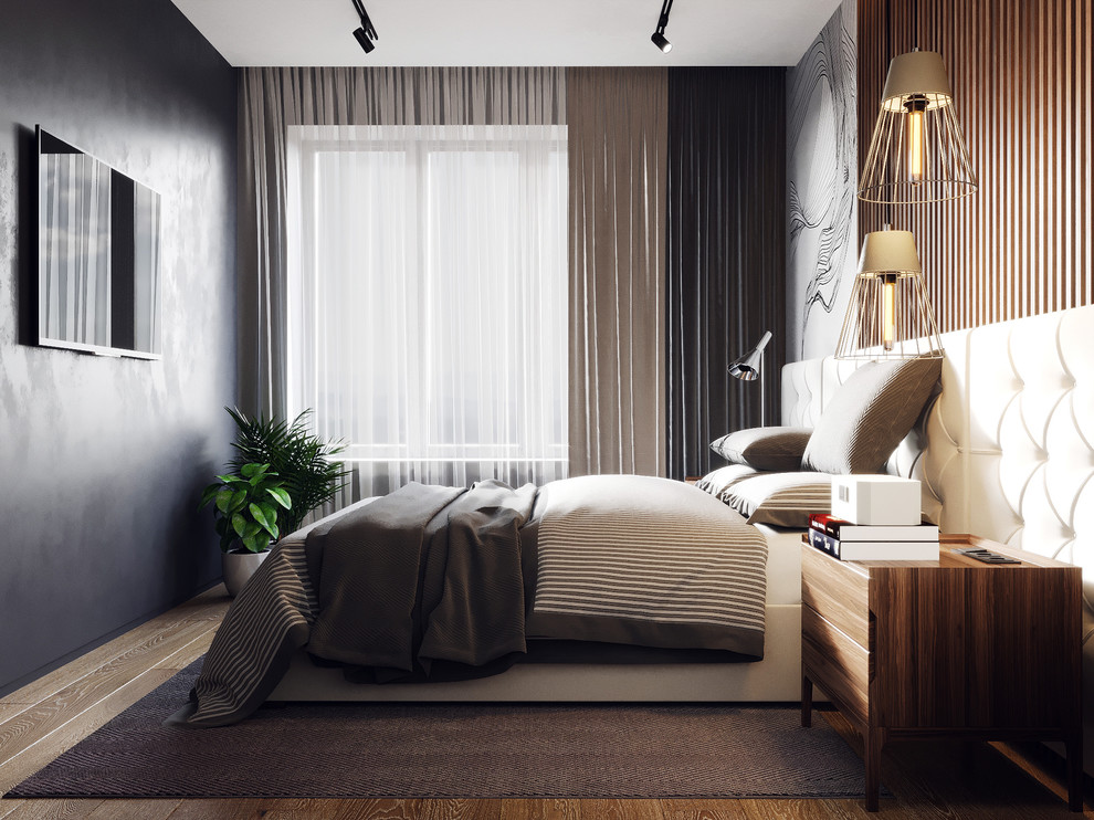 Imagen de dormitorio principal contemporáneo de tamaño medio con paredes grises, suelo de madera en tonos medios y suelo beige