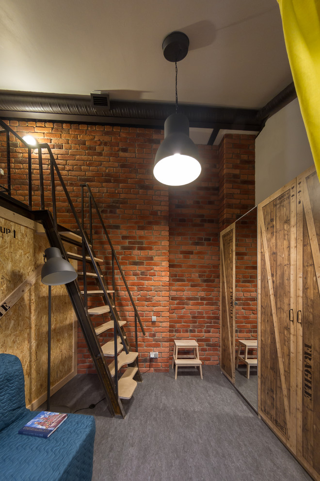 This is an example of an industrial mezzanine bedroom in Saint Petersburg with lino flooring and brown walls.