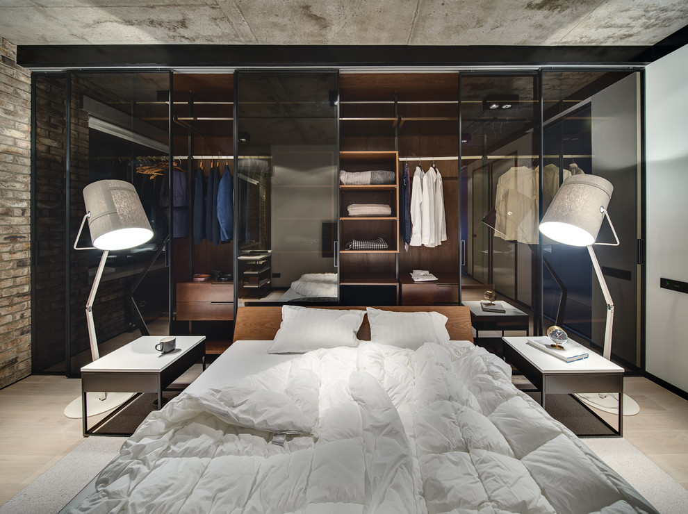 Inspiration for an industrial bedroom in Moscow with beige floors and feature lighting.