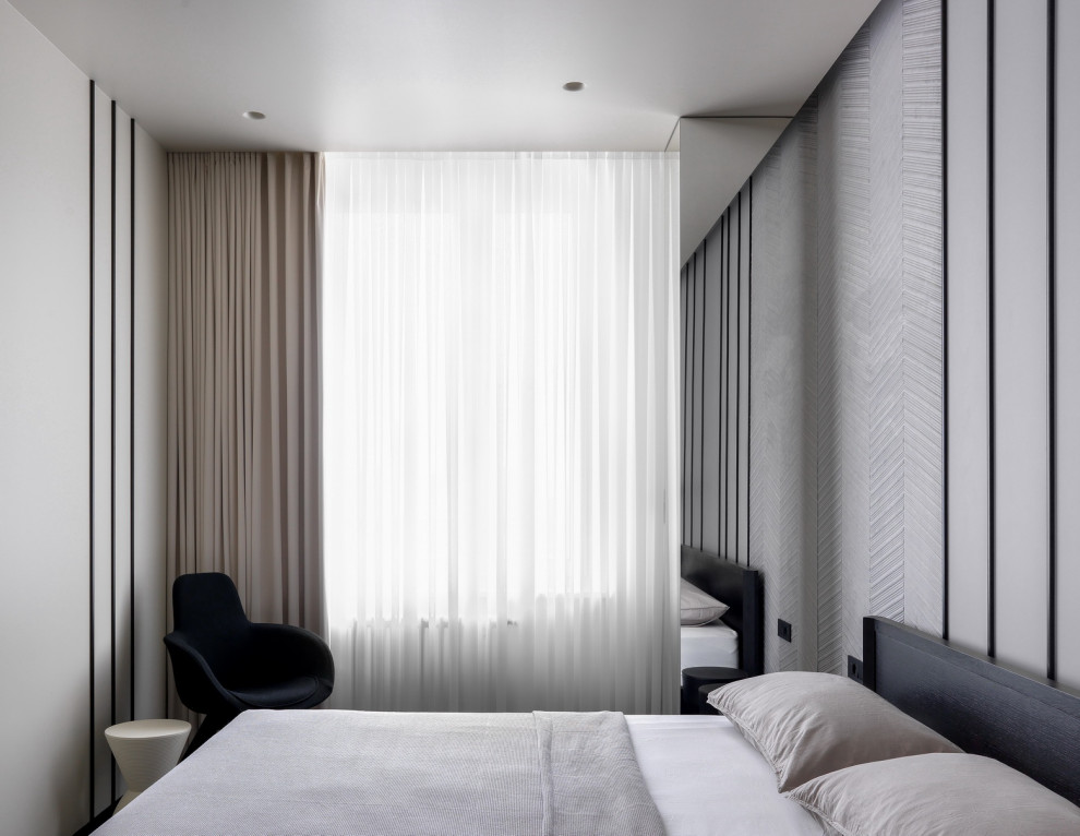 Idee per una camera matrimoniale design di medie dimensioni con pareti beige, parquet scuro e pavimento nero