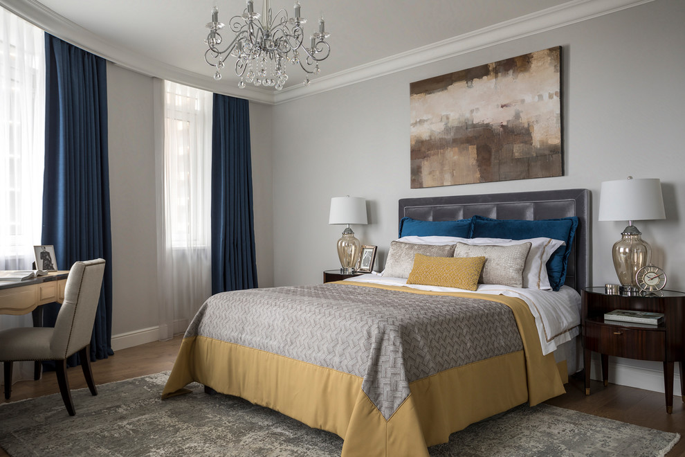 Example of a classic master medium tone wood floor and brown floor bedroom design in Moscow with gray walls