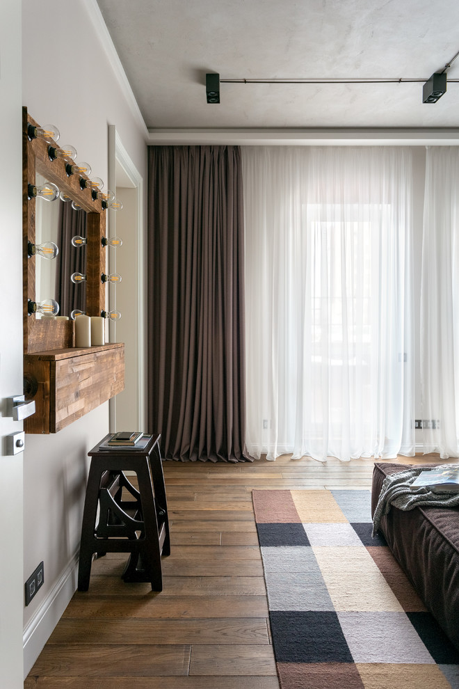 Inspiration for a contemporary grey and brown bedroom in Moscow with white walls, medium hardwood flooring and brown floors.