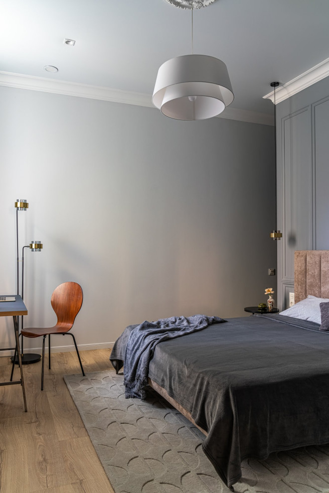Photo of a medium sized scandinavian master bedroom in Saint Petersburg with grey walls, medium hardwood flooring, no fireplace, brown floors and wallpapered walls.
