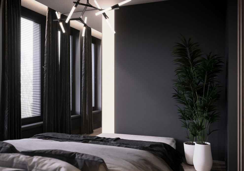Ejemplo de dormitorio principal nórdico de tamaño medio con paredes negras, suelo de madera clara y suelo beige