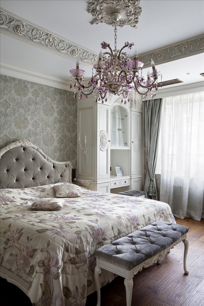This is an example of a classic master bedroom in Moscow with multi-coloured walls and medium hardwood flooring.