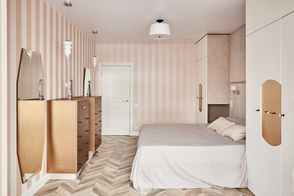 Example of a trendy master light wood floor and beige floor bedroom design in Other with beige walls