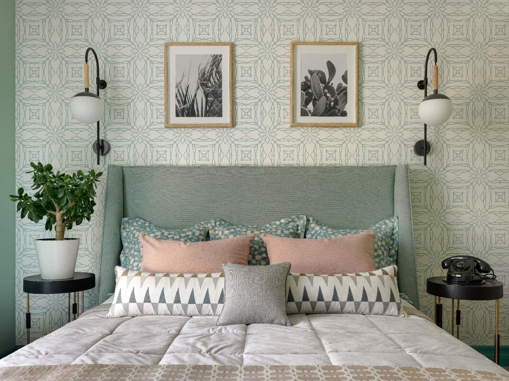 Mid-sized danish master medium tone wood floor bedroom photo in Other with green walls