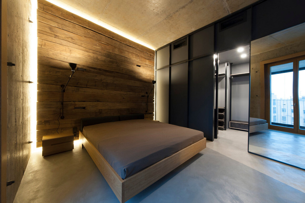 This is an example of a medium sized urban master bedroom in Moscow with grey walls, concrete flooring, no fireplace and grey floors.