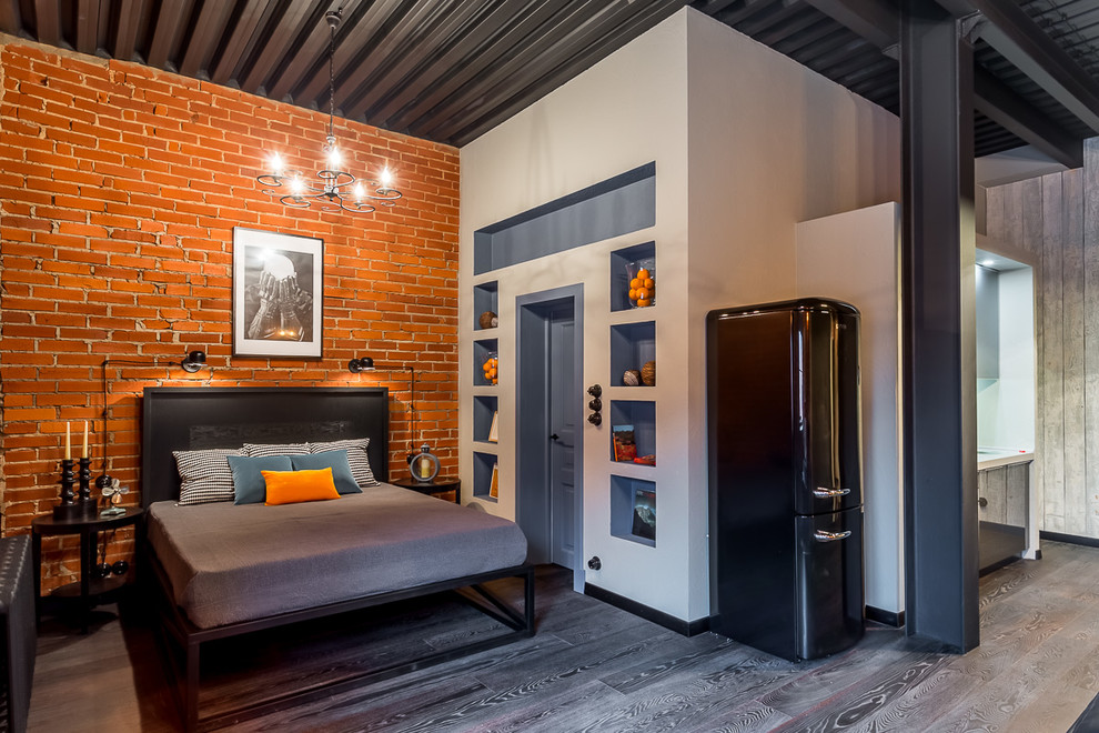 Urban master bedroom in Moscow with dark hardwood flooring and no fireplace.