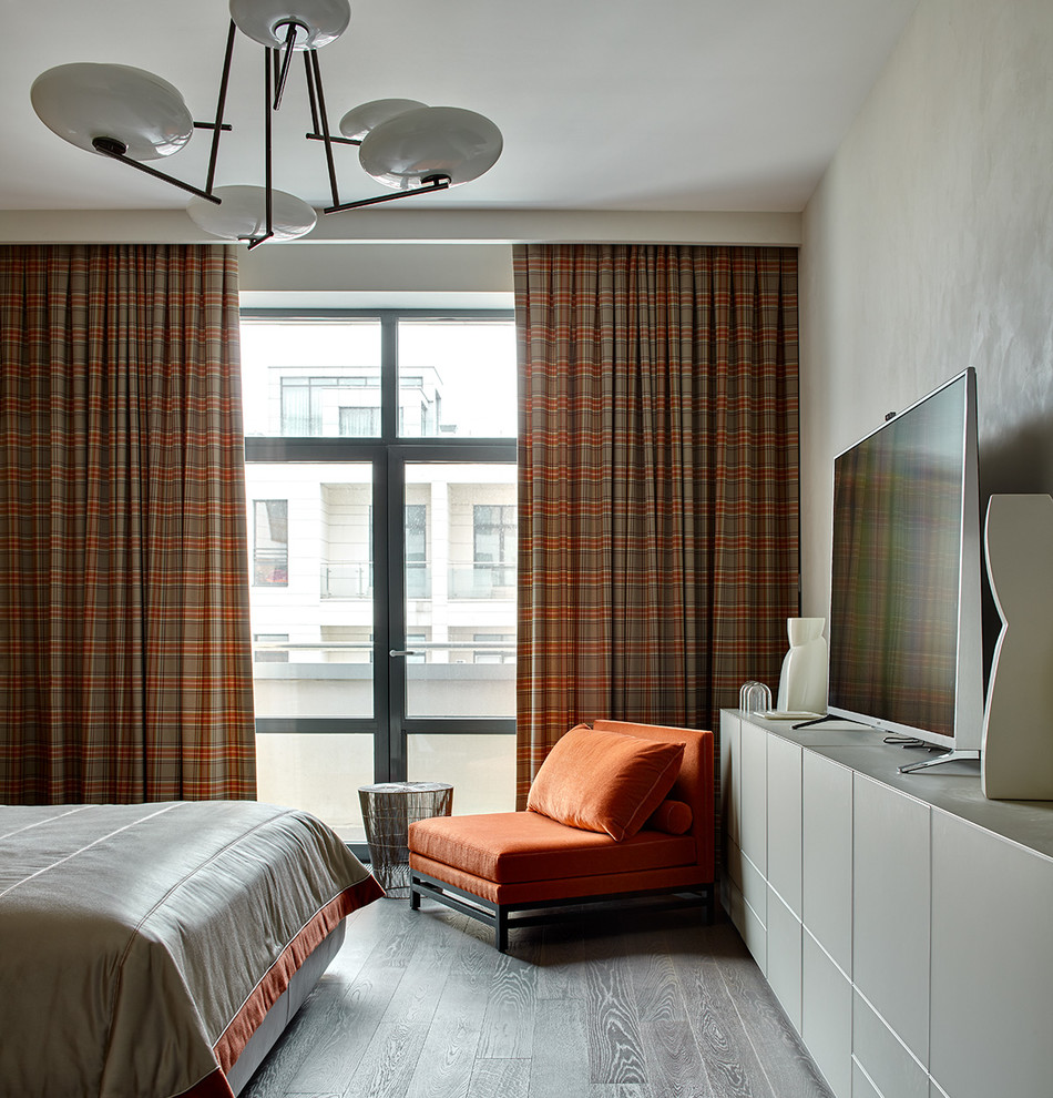 Inspiration for a contemporary master and grey and brown bedroom in Moscow with dark hardwood flooring and beige walls.