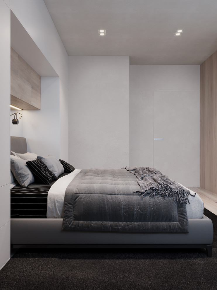 Imagen de dormitorio principal actual pequeño con paredes grises, suelo de madera clara y suelo beige