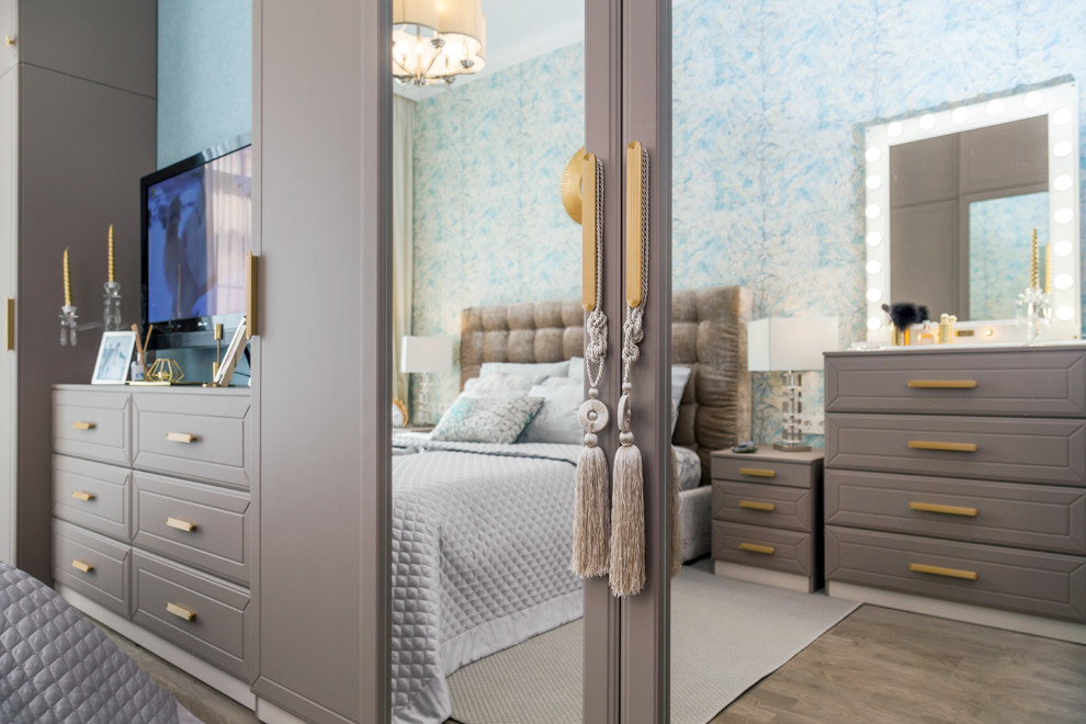 Small traditional master bedroom in Saint Petersburg with multi-coloured walls, medium hardwood flooring and beige floors.
