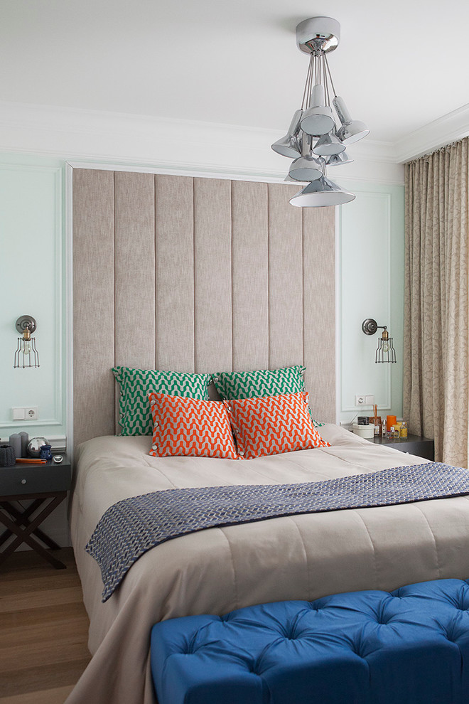 Contemporary guest bedroom in Moscow with white walls, no fireplace and light hardwood flooring.