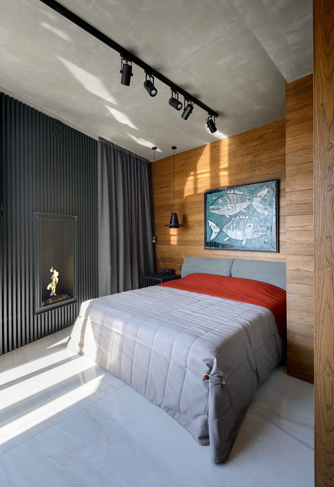 Imagen de dormitorio principal actual con paredes marrones, todas las chimeneas y suelo beige
