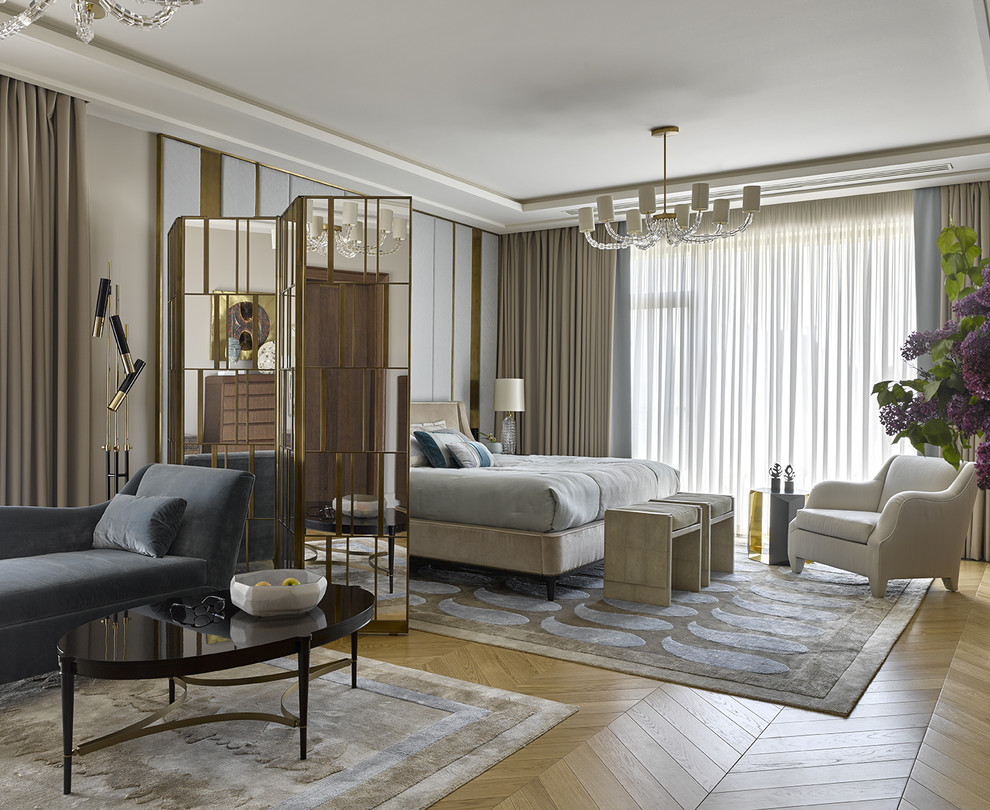 Inspiration for a classic master bedroom in Saint Petersburg with light hardwood flooring and beige walls.