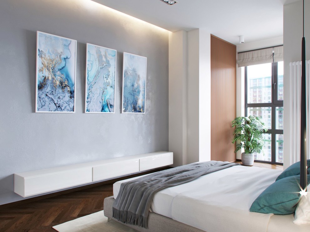 На фото: хозяйская спальня среднего размера в современном стиле с белыми стенами и полом из ламината без камина