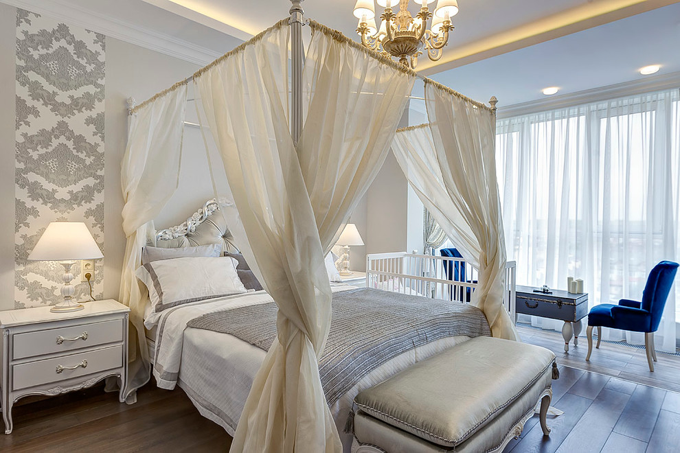 This is an example of a traditional master bedroom in Moscow with grey walls, no fireplace and dark hardwood flooring.