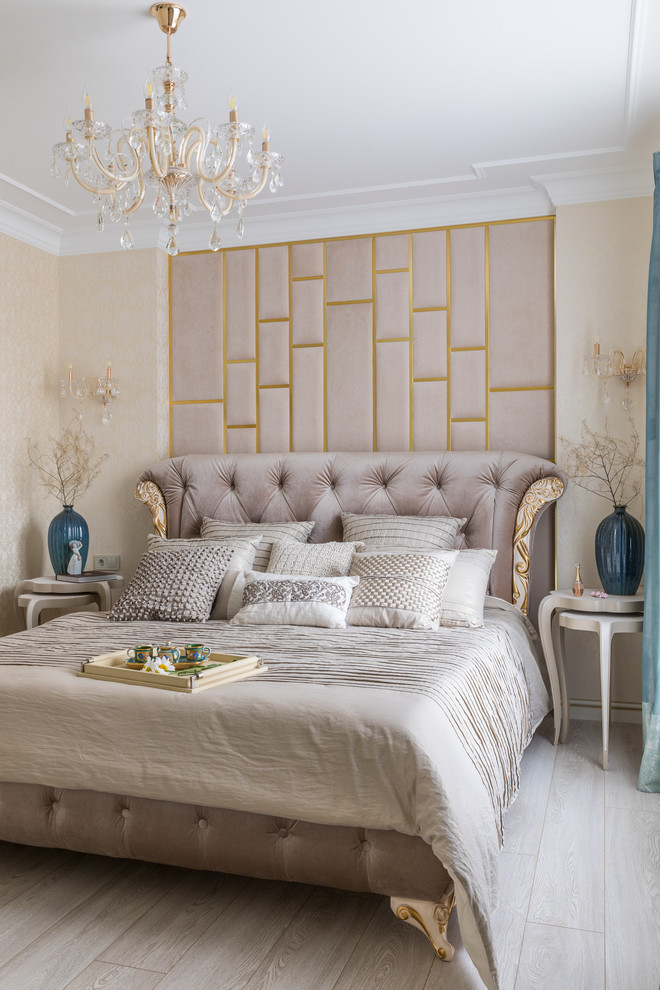Transitional light wood floor and beige floor bedroom photo in Other with beige walls