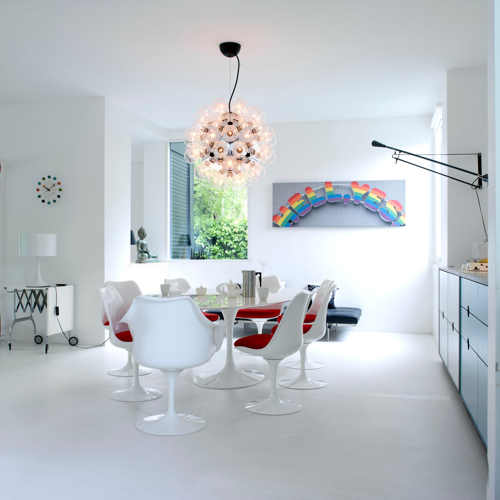 Photo of a medium sized contemporary dining room in Copenhagen with white walls and white floors.