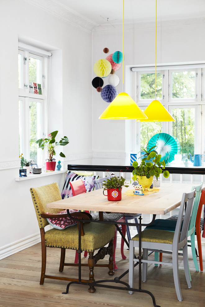 Bohemian dining room in Wiltshire with white walls.