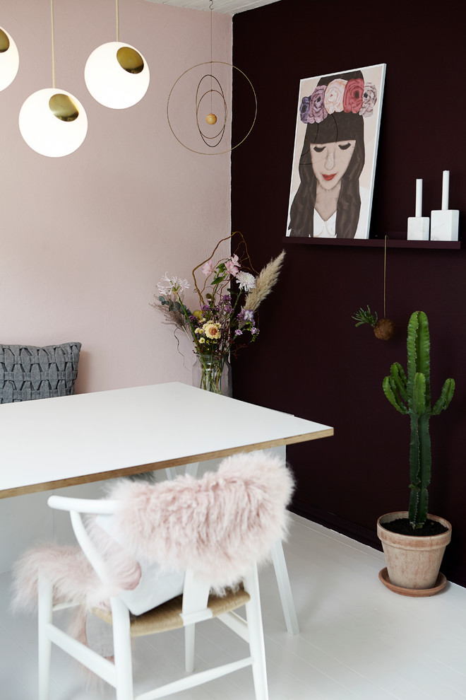 Inspiration for a mid-sized scandinavian dining room remodel in Wiltshire with multicolored walls