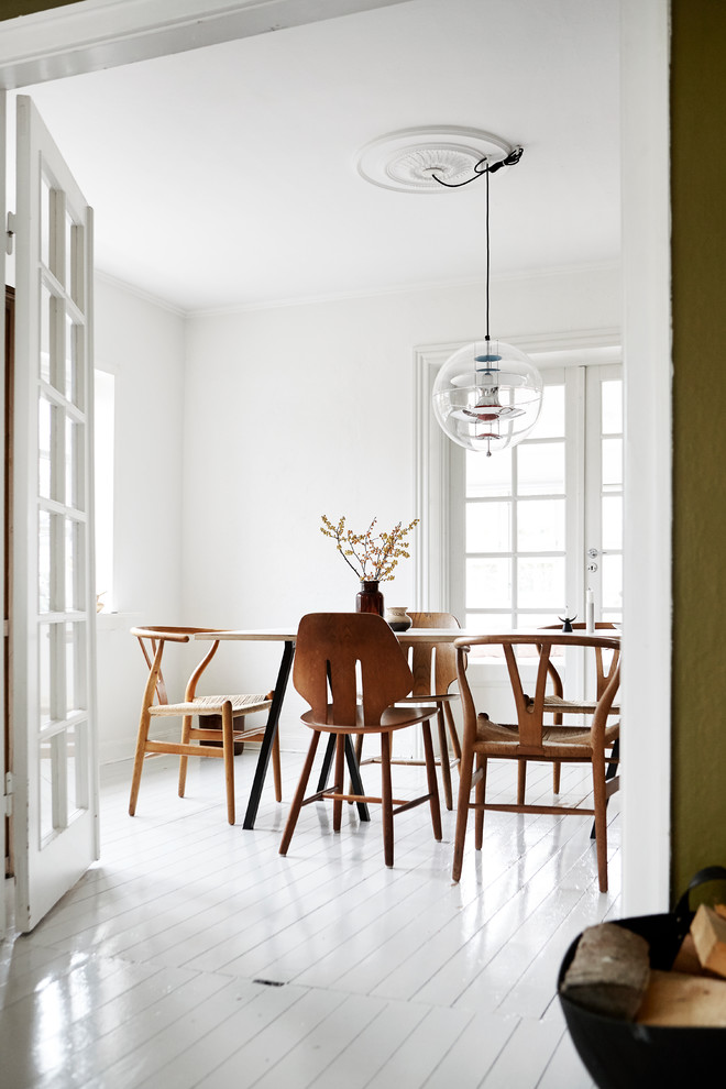 Inspiration for a scandi dining room in Aarhus with feature lighting.