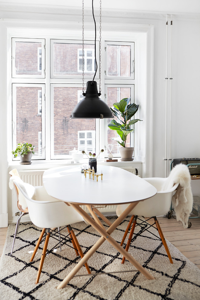 Inspiration for a scandinavian dining room remodel in Wiltshire