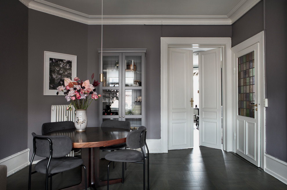 Dining room - scandinavian dark wood floor and black floor dining room idea in Copenhagen with gray walls