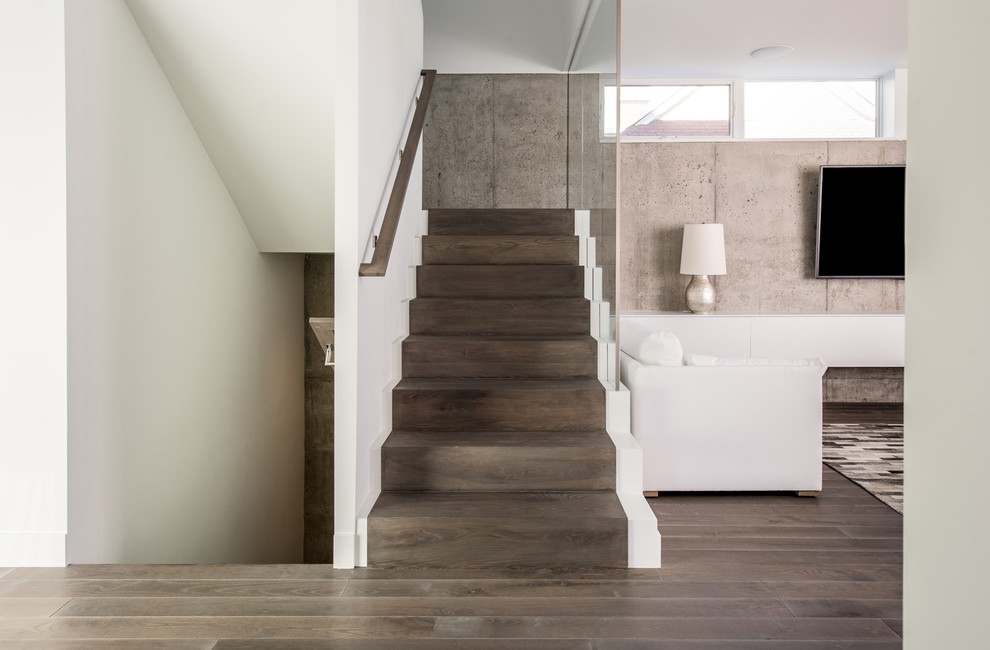 Design ideas for a modern wood u-shaped staircase in Minneapolis with wood risers and feature lighting.