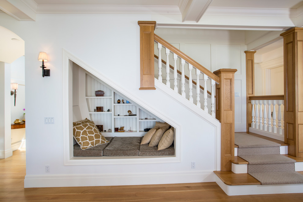 Mid-sized beach style wooden l-shaped staircase photo in Seattle with painted risers
