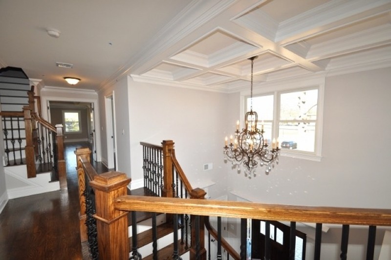 Photo of a modern wood curved staircase in New York with wood risers.