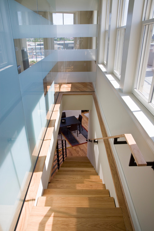 Photo of a contemporary wood straight staircase in DC Metro with open risers.