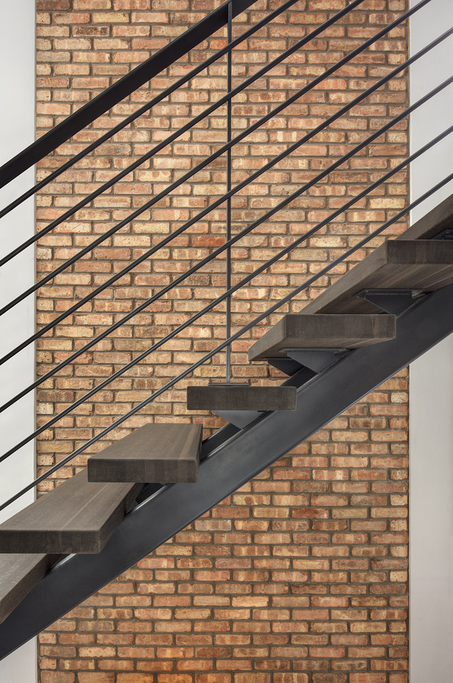 Imagen de escalera suspendida actual de tamaño medio sin contrahuella con escalones de madera