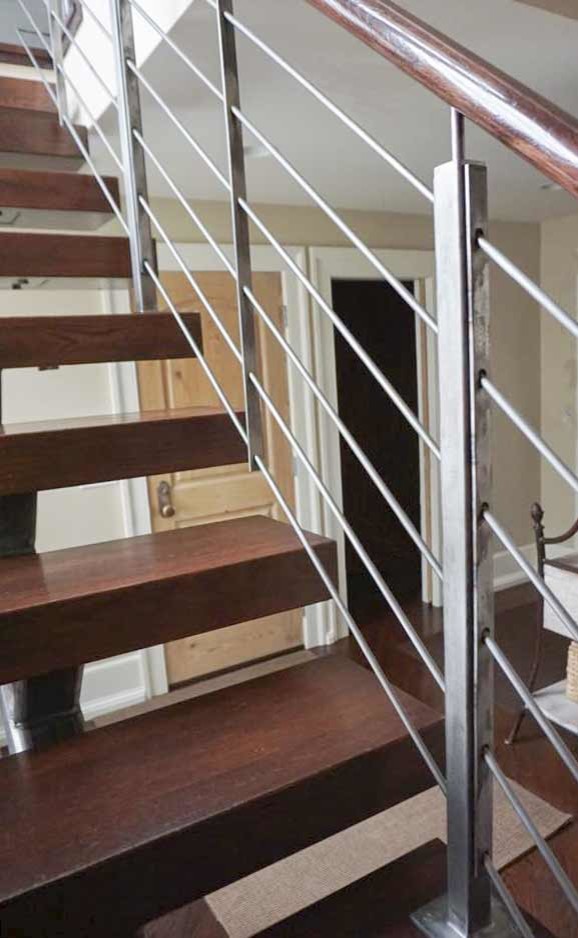 This is an example of a small industrial wood straight mixed railing staircase in DC Metro.