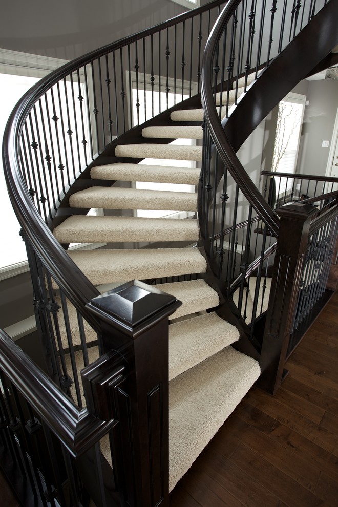 180 degree open rise stair Traditional Staircase Edmonton by Specialized Stair and Rail