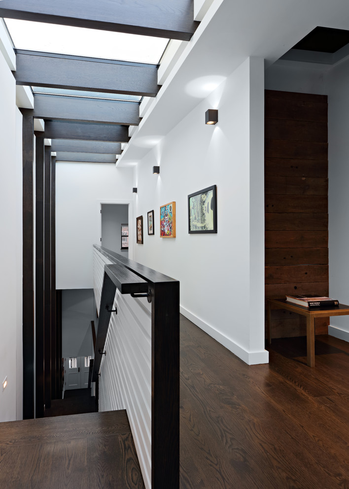 Inspiration for a mid-sized modern wooden straight wood wall and wood railing staircase remodel in New York with wooden risers